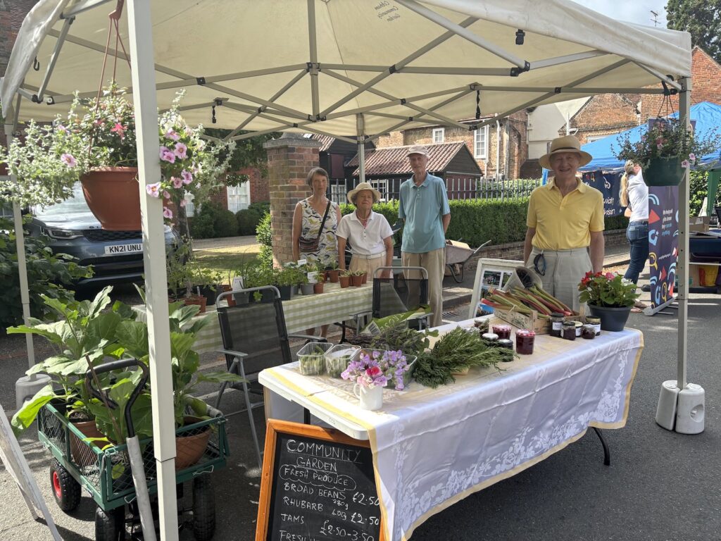 Members of Cobham Community Garden on a stall at the Farmer's Market