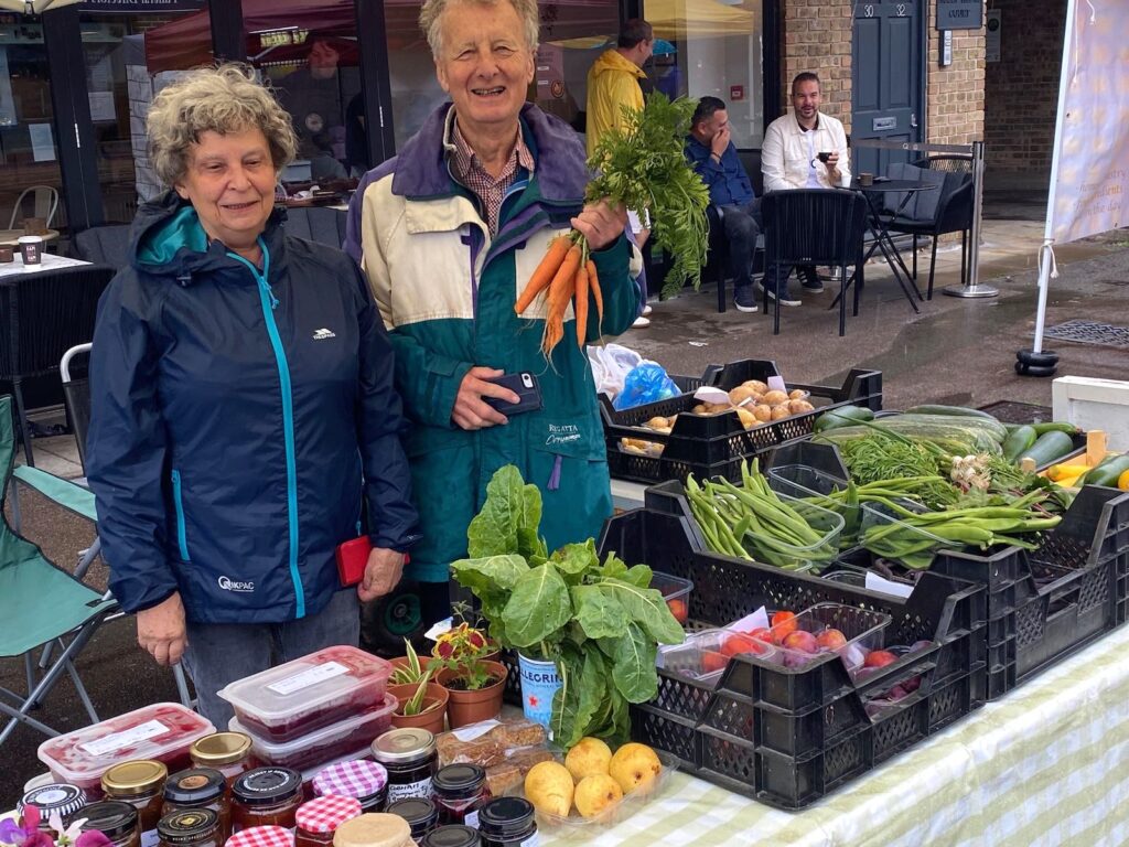 Members of Cobham Community Garden on a stall at the Farmer's Market